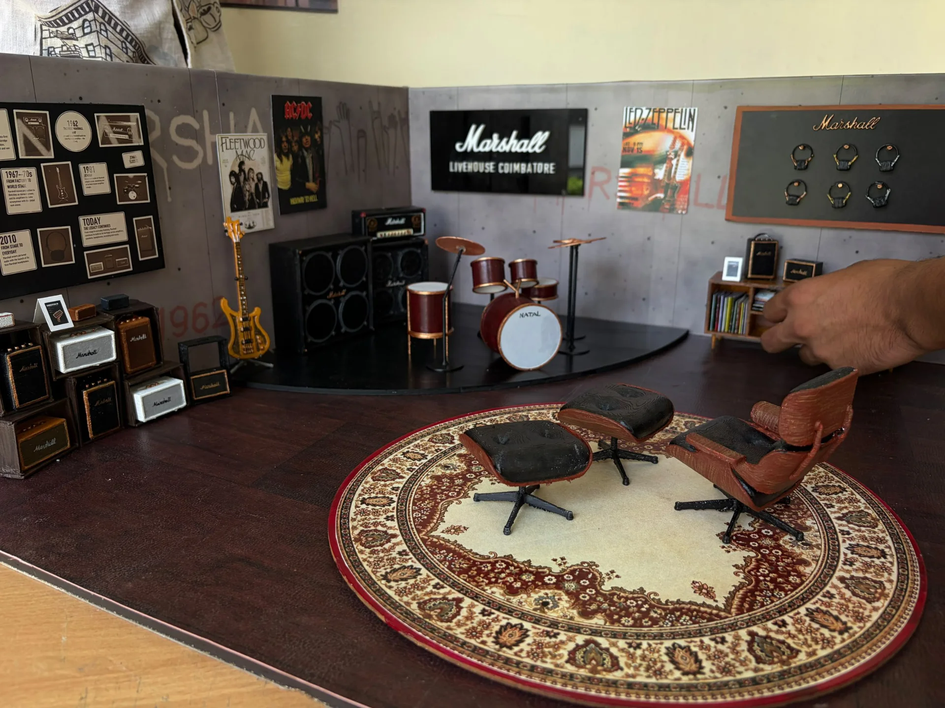 The finished 1:10 model of Marshall Livehouse: the history wall, stage, sign and lounge chairs on the rug